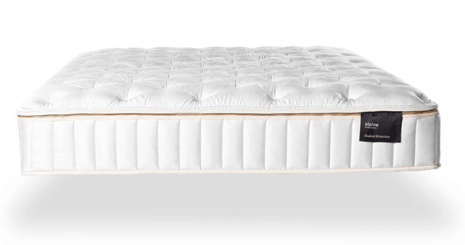 White tufted mattress with elegant design and zippered cover.
