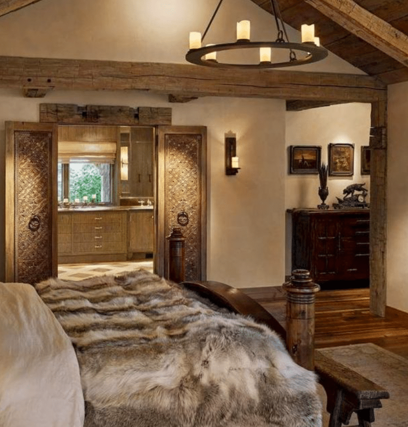 a luxe bedroom with a bed and a mirror