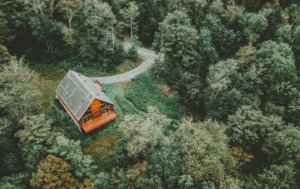 a lovely house in the forest surrounded by trees
