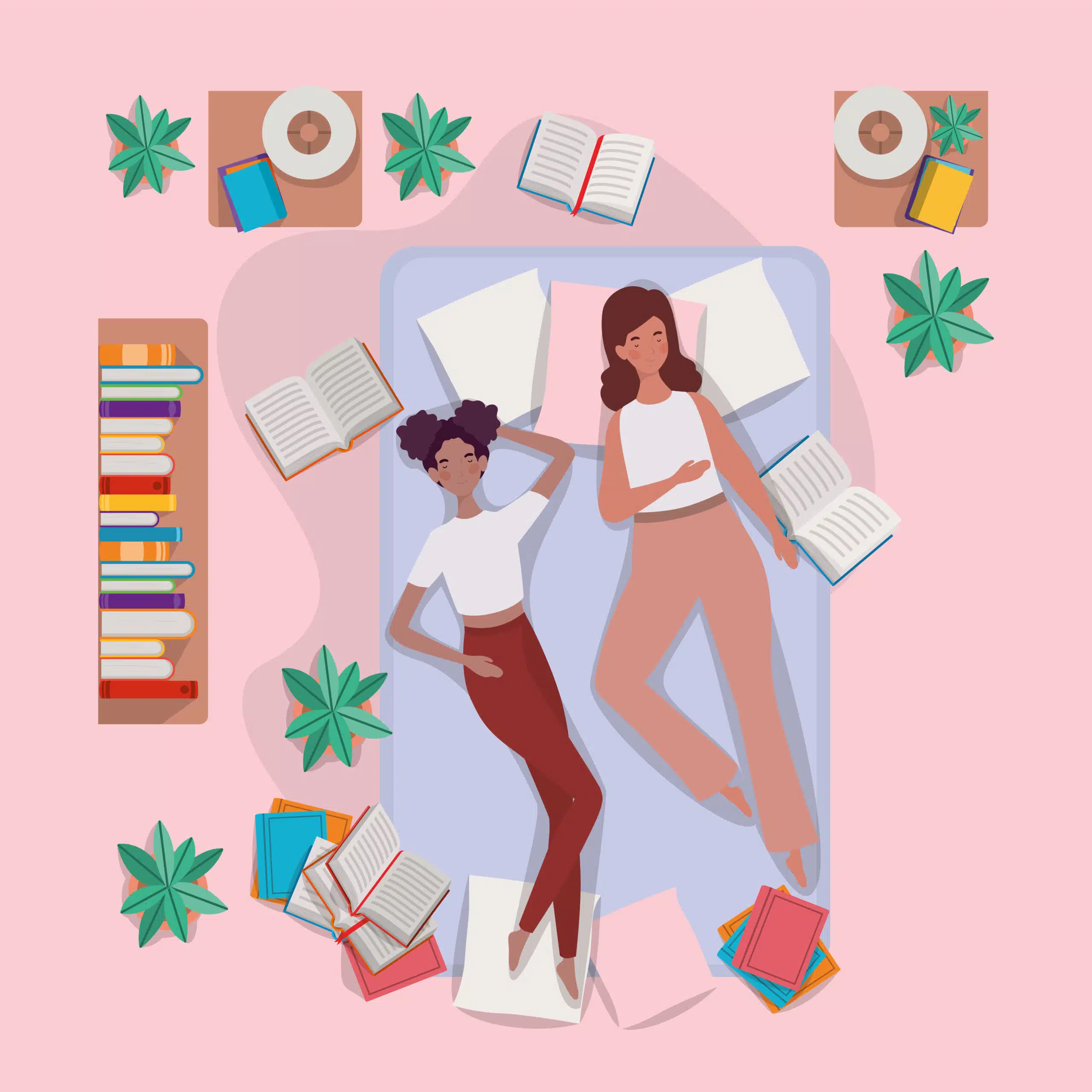 Two women lying on a bed figuring out how to make their DIY mattress
