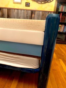 An all-foam diy mattress in a guest cottage without the zippered cover  so you can see the layers
