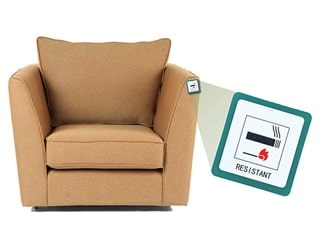 Upholstered chair with flame retardant warning