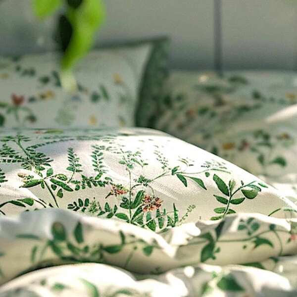 a bed with a floral pattern