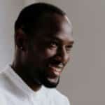 Man in White Crew Neck Shirt Smiling