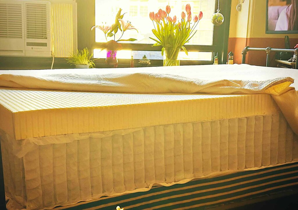 a DIY hybrid mattress with the cover unzipped