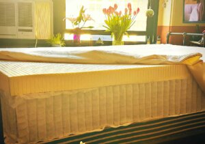 a DIY hybrid mattress with the cover unzipped