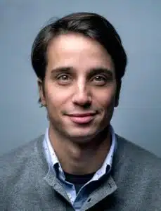 a man smiling for a picture