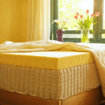 An unzipped diy mattress on a bed