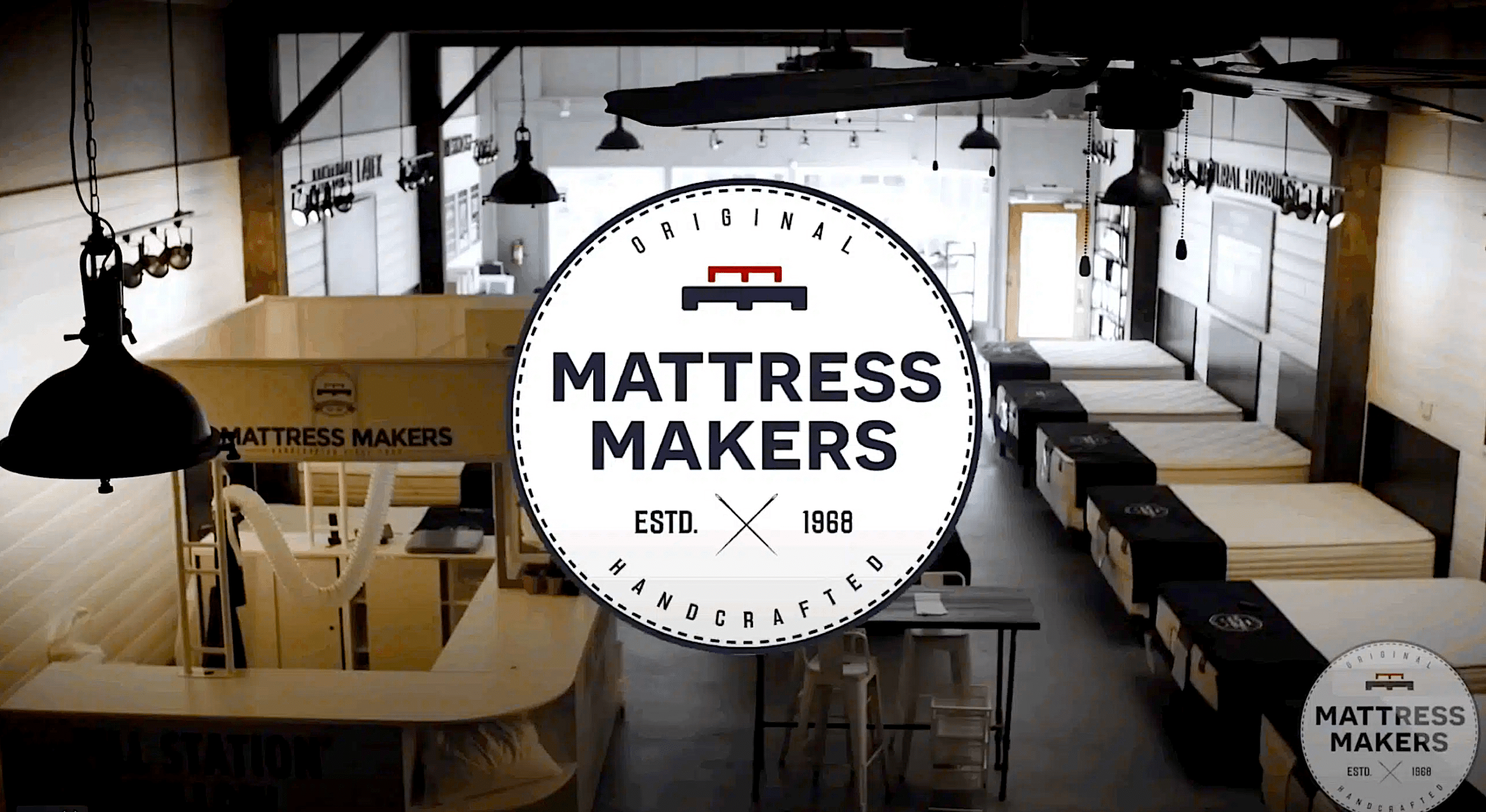 Showroom with mattresses displayed.